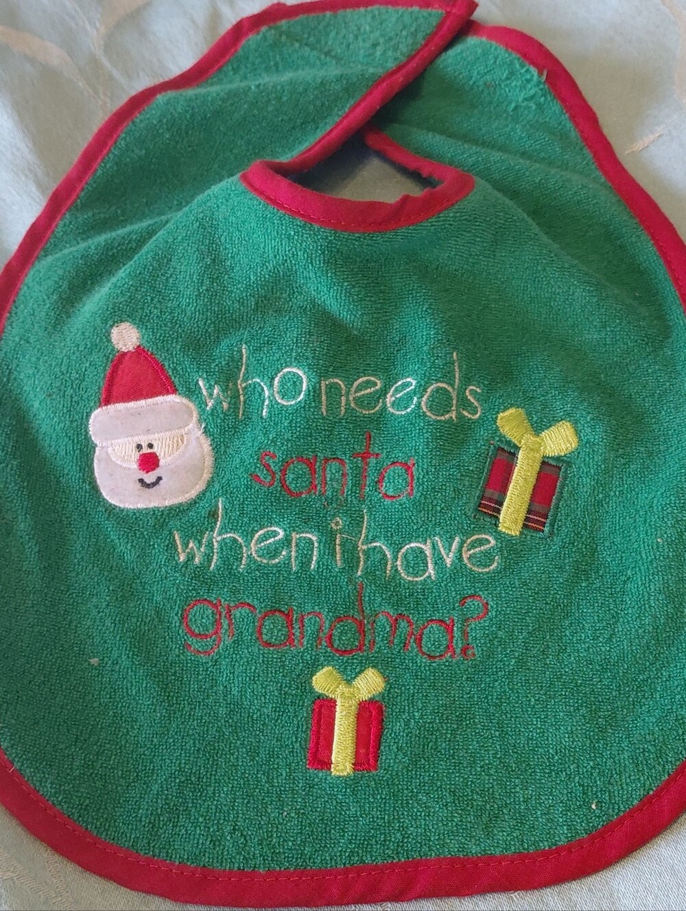 Tender Kisses Green Christmas Bib with Santa and Presents